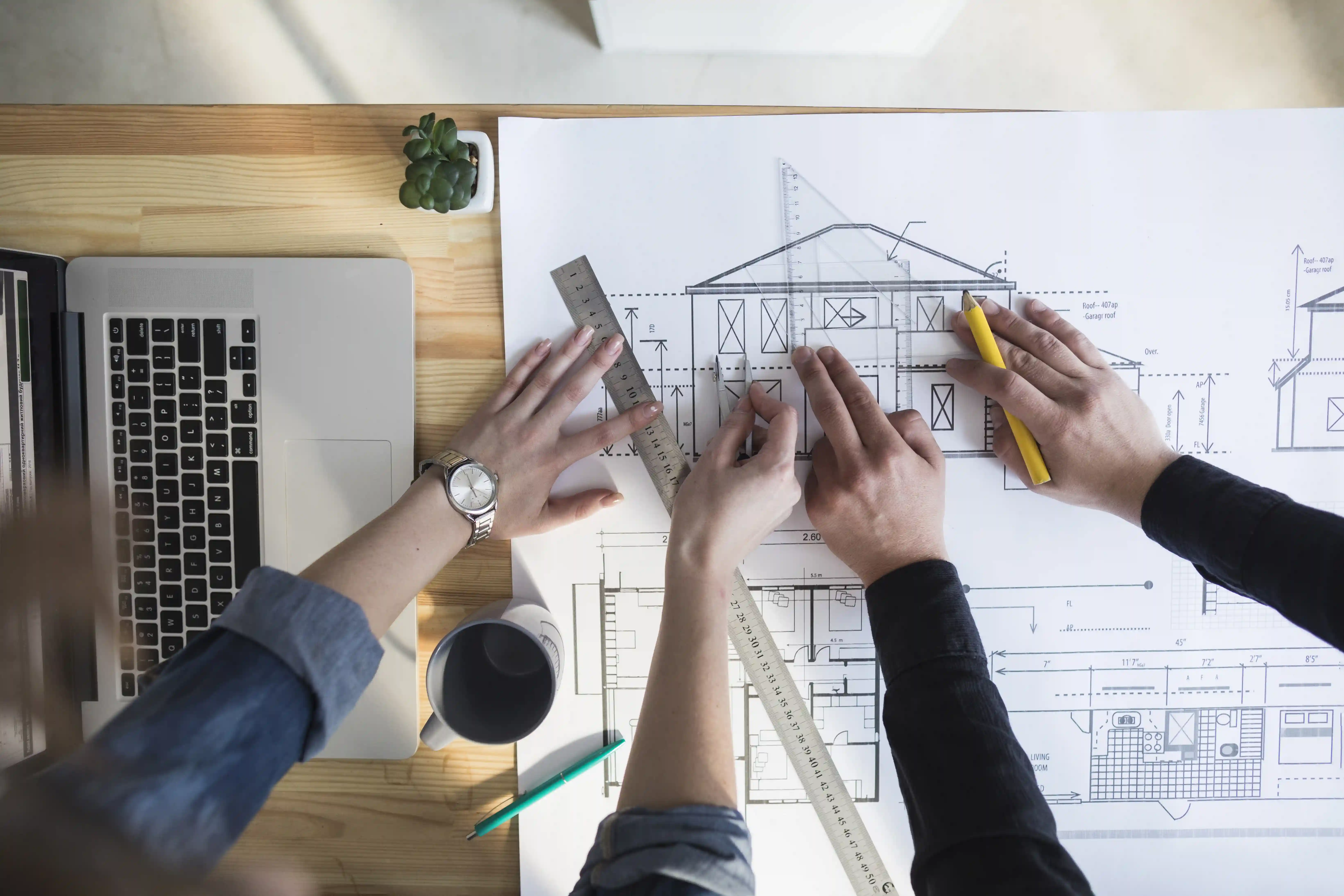 Architect working on blueprints