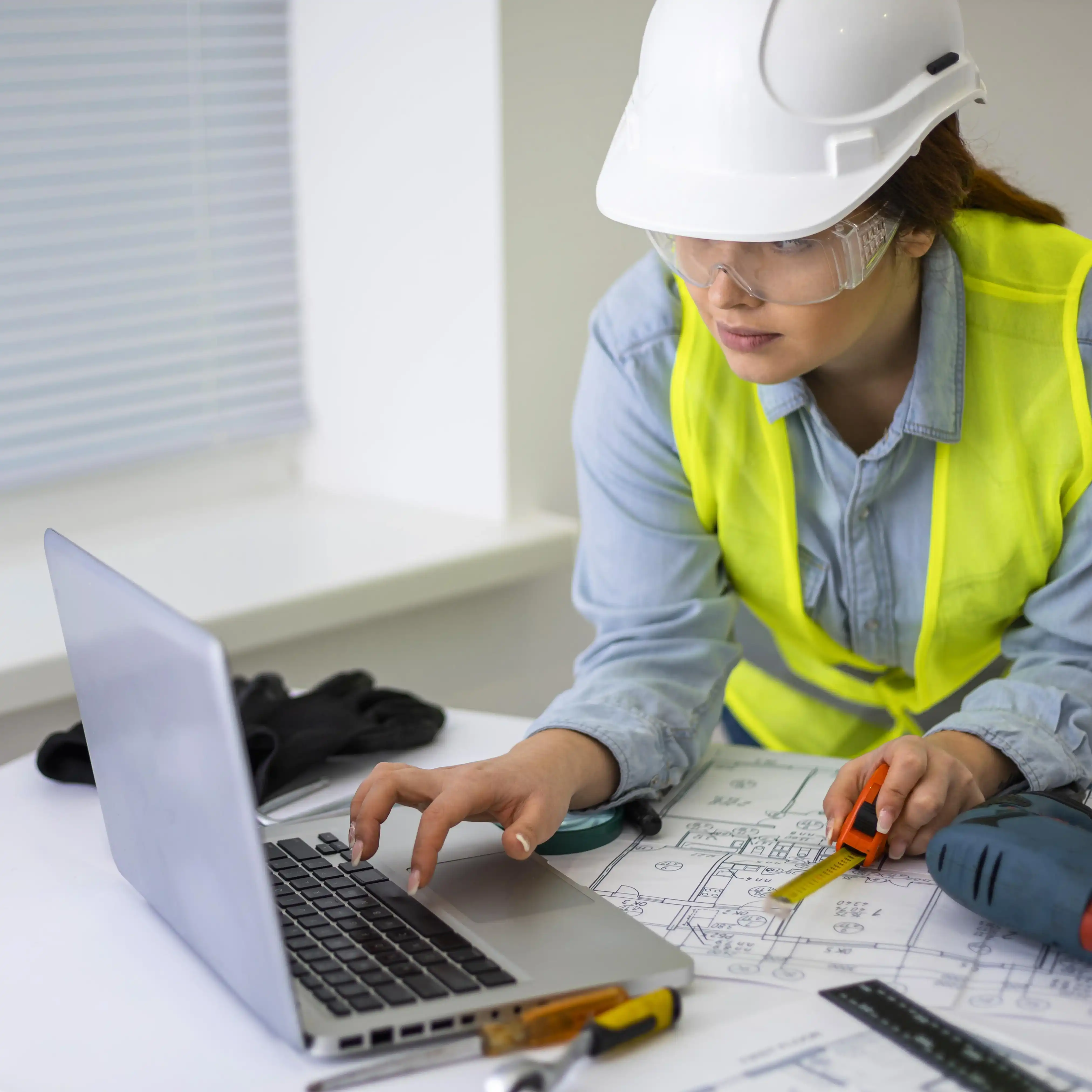 Female engineer working on construction plans